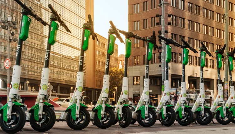 A row of e-scooters on a pavement in Berlin