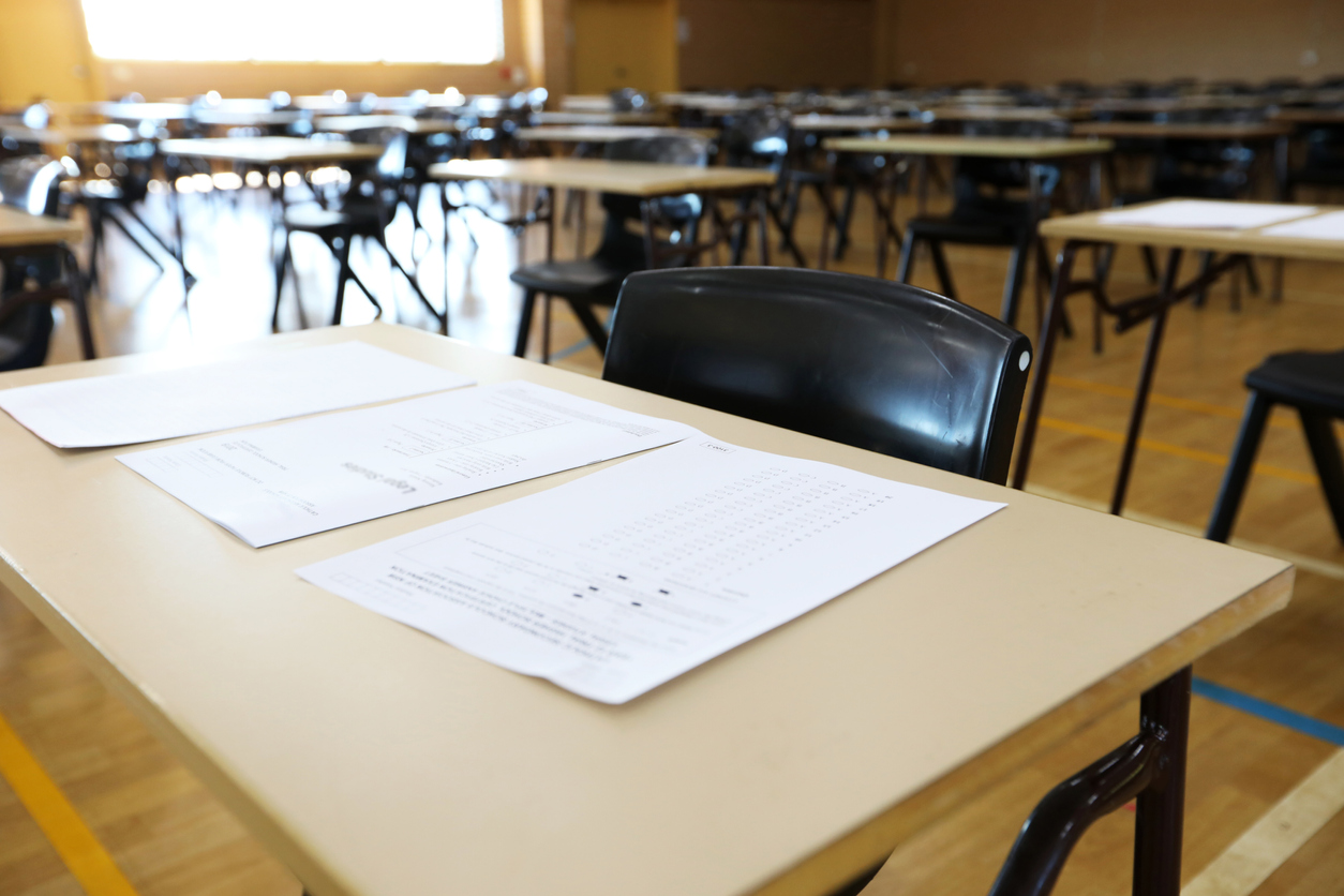 Desks in an empty exam halll