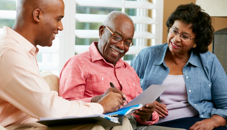A senior couple meeting with an estate planning lawyer