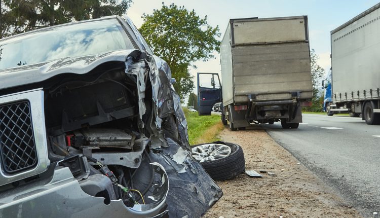 Car collision with heavy truck