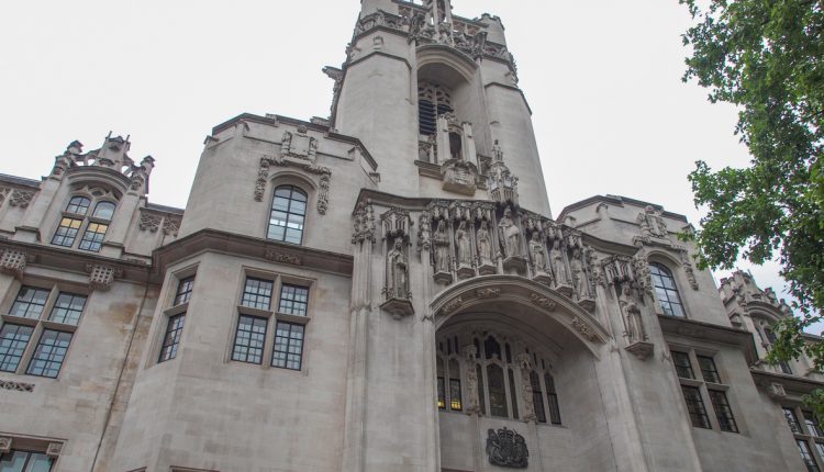 London Supreme court beneath grey sky