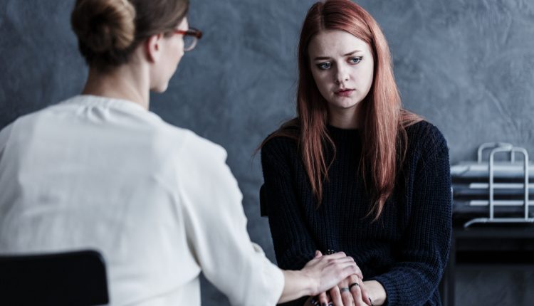 Therapist encouraging patient in the office