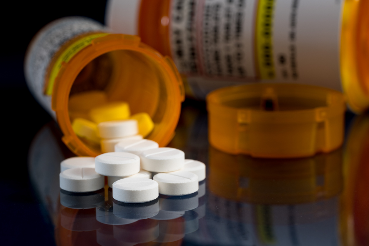 Oxycodone opioid tablets in prescription bottles