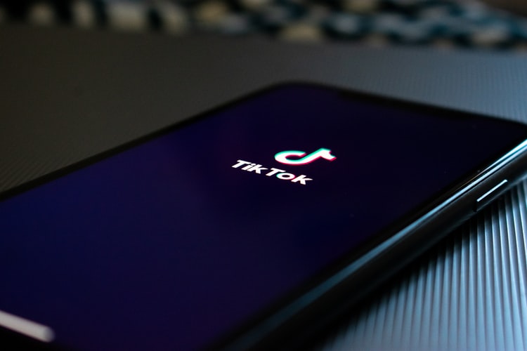 TikTok app displayed on smartphone on table