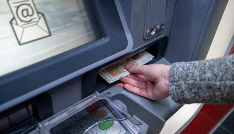 Woman withdrawing cash from an ATM