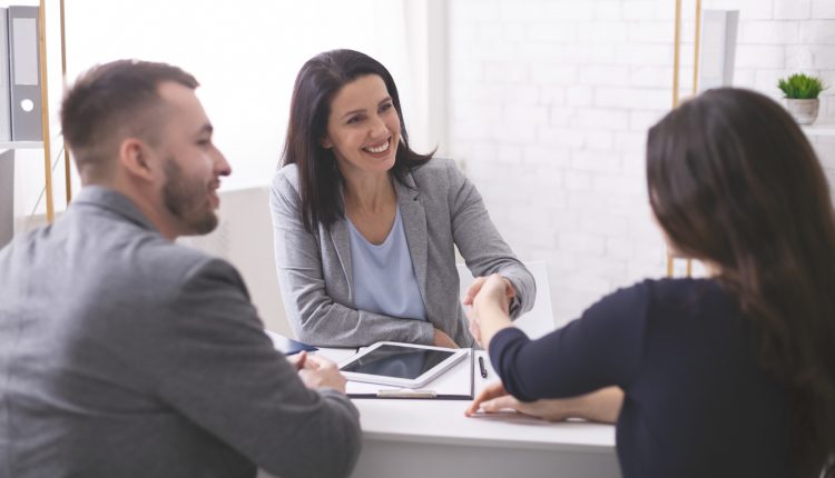 Lawyer having a positive meeting with two clients
