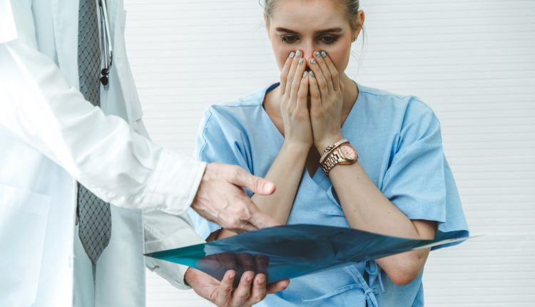 Female patient receiving bad news from a doctor