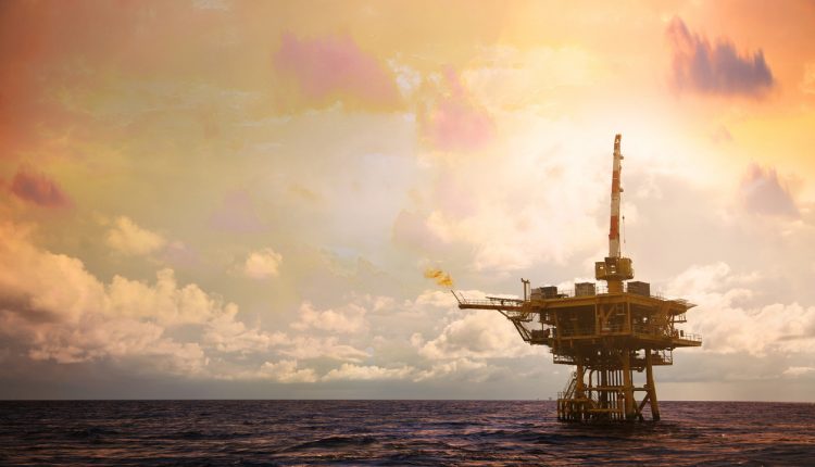 Offshore oil platform in the Gulf of Mexico at sunset