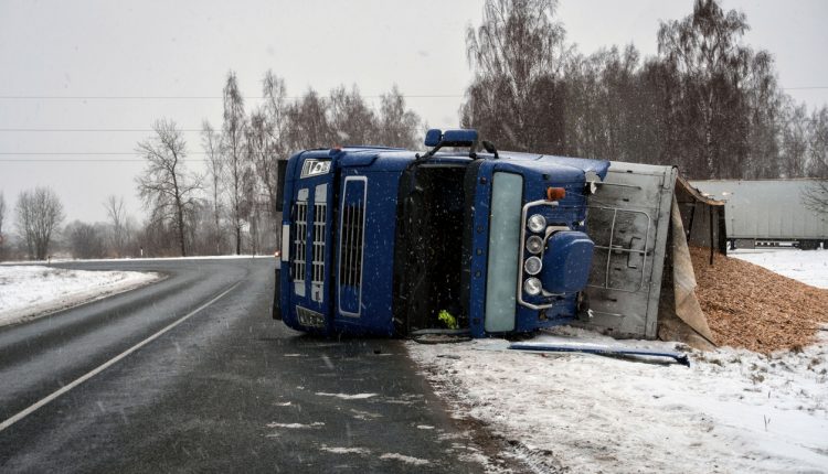 Overturned truck on an icy road