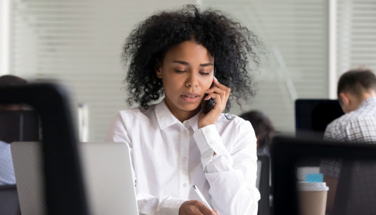 Young professional woman on phone about professional negligence claims