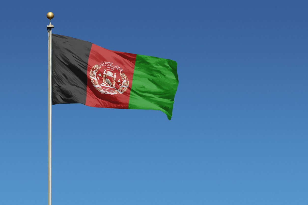 National flag of Afghanistan on clear blue sky