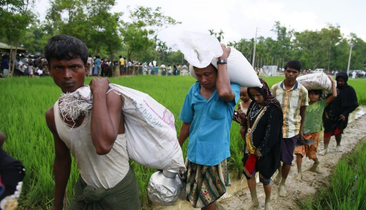 Rohingya Muslims flee violence in Myanmar