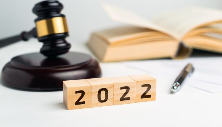 Concept of the court and law with a judge's gavel in 2022 year
