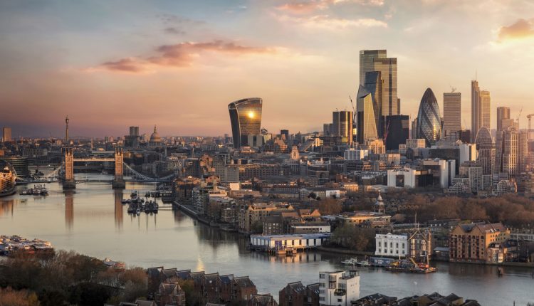 The skyline of London city with Tower Bridge and financial district during sunrise