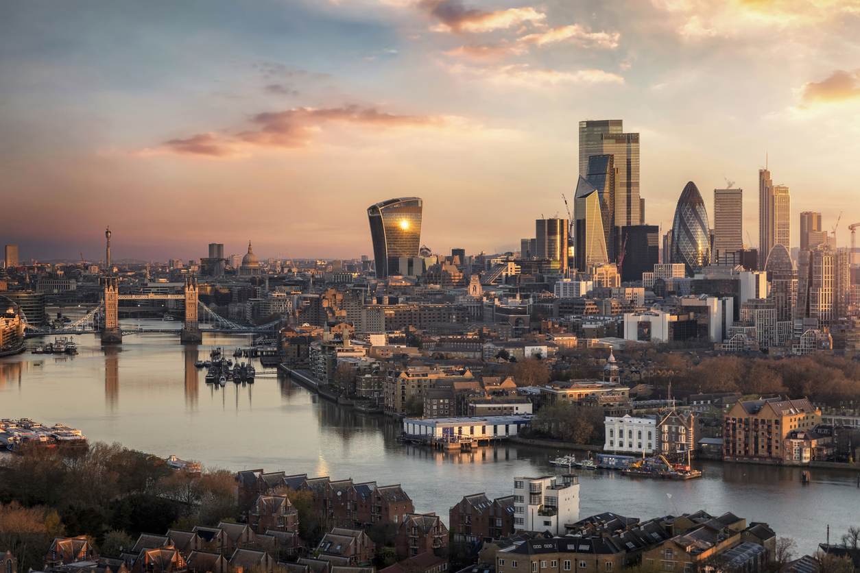 The skyline of London city with Tower Bridge and financial district during sunrise