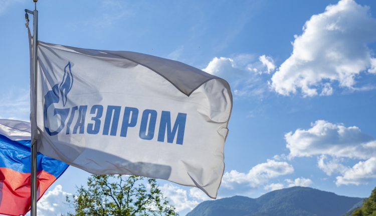 Gazprom flag against blue sky