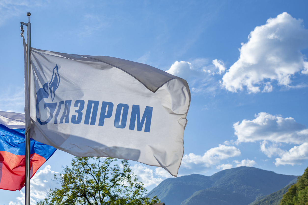 Gazprom flag against blue sky