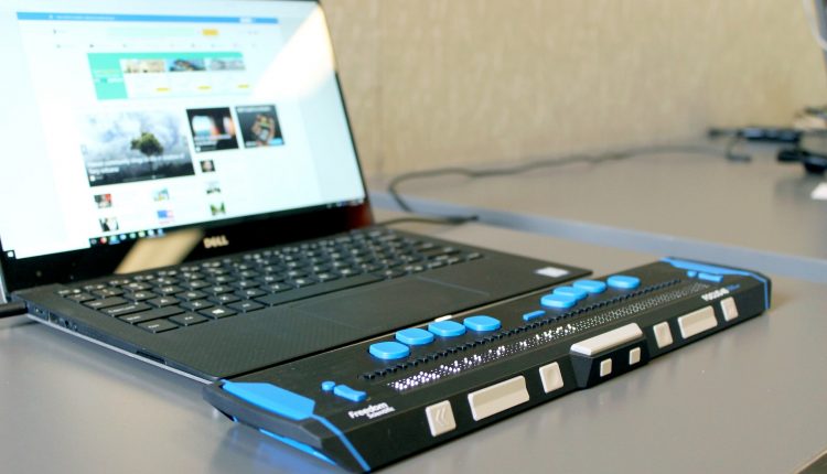 Laptop with braille display for disabled employee