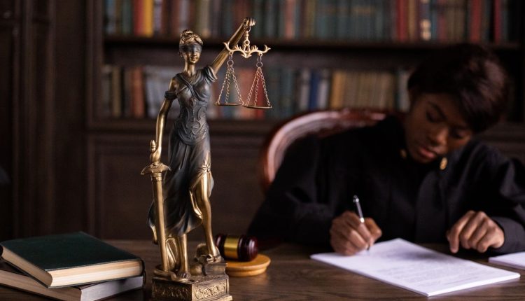 Lady justice on desk