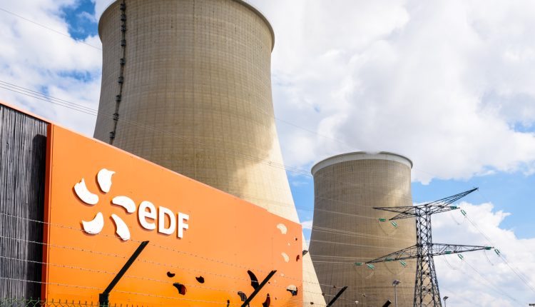EDF sign and cooling towers of the nuclear power plant of Nogent-sur-Seine, France.