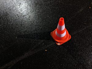 A traffic cone marking a traffic incident