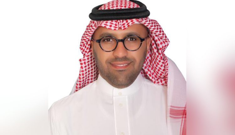 Saudi Arabian ADR specialist in front of white background.