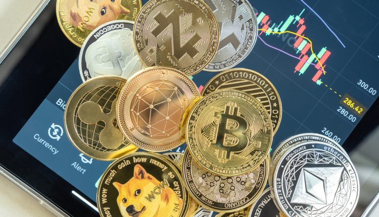 Cryptocurrency coins displayed on smartphone trading app