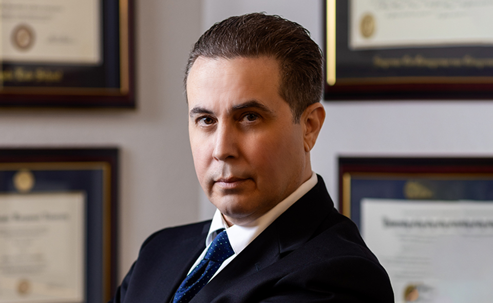 Experienced family lawyer Kennedy Koblin standing in his office.