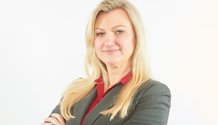 Experienced healthcare lawyer Helen Oscislawski in front of a white background.