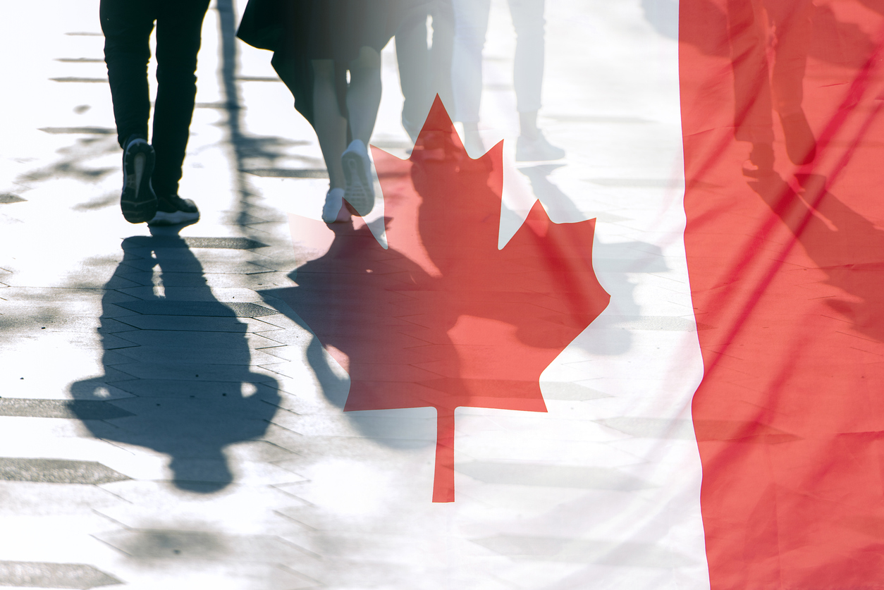 The National Flag of Canada and shadows of people, concept picture