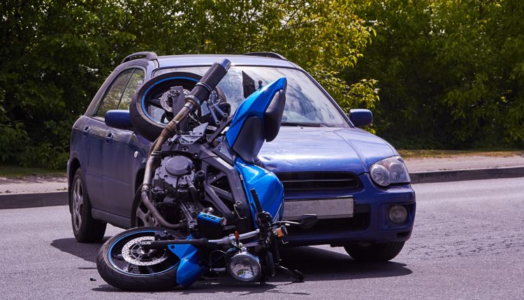 June 4, 2020, Riga, Latvia, damaged car and motorbike on the city road at the scene of an accident