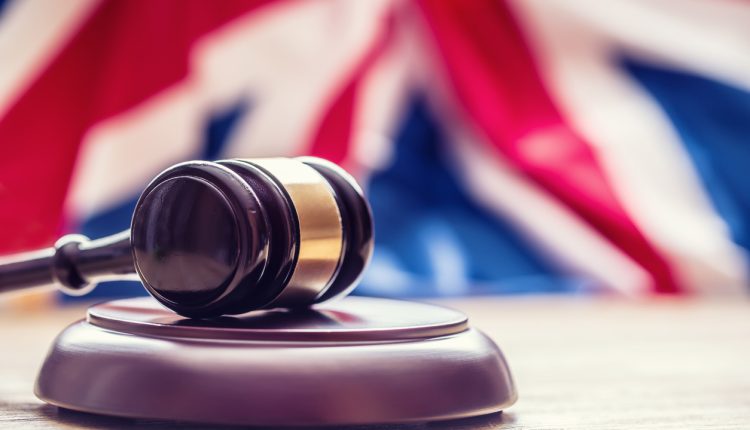 Gavel in front of a UK Flag.