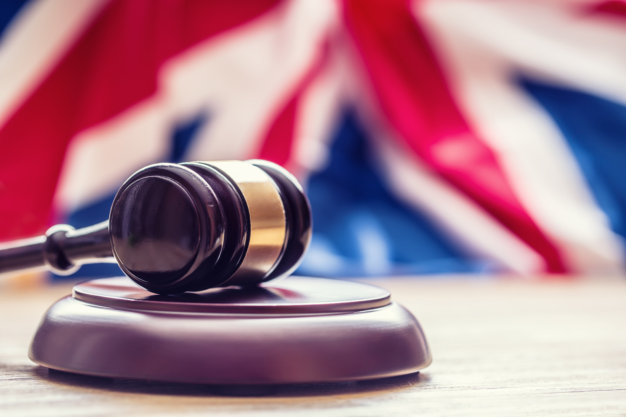 Gavel in front of a UK Flag.