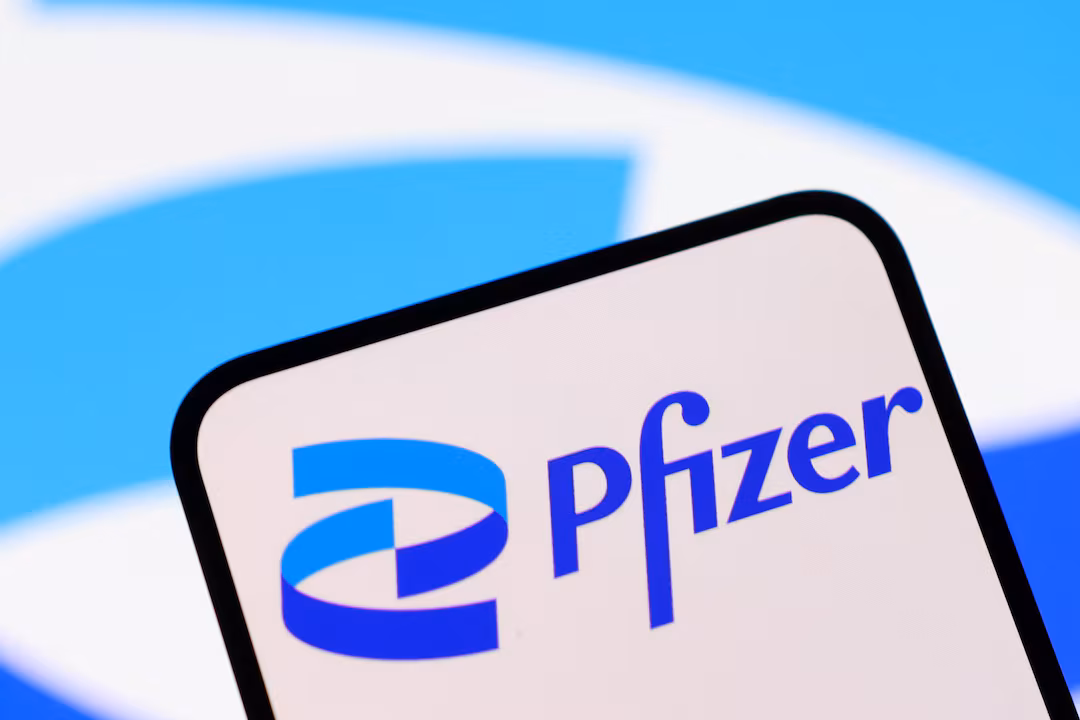Pfizer logo displayed on a smartphone with blurred Pfizer branding in the background, representing pharmaceutical lawsuits and Depo-Provera class action cases.