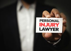 personal injury lawyer showing card with typography on it, close up. person, lawyer, injury lawyer, justice, practice