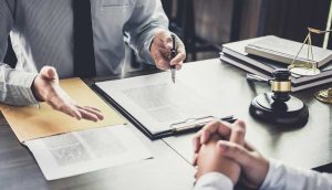 Attorney reviewing documents with an injured client