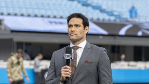 Mark Sanchez reporting for Fox Sports at an NFL stadium before kickoff.