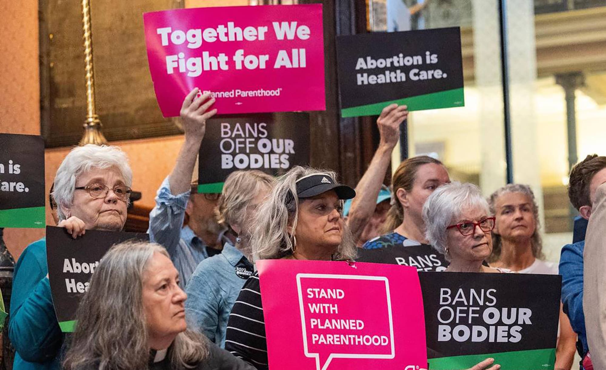 people protest in opposition of a bill that bans abortions