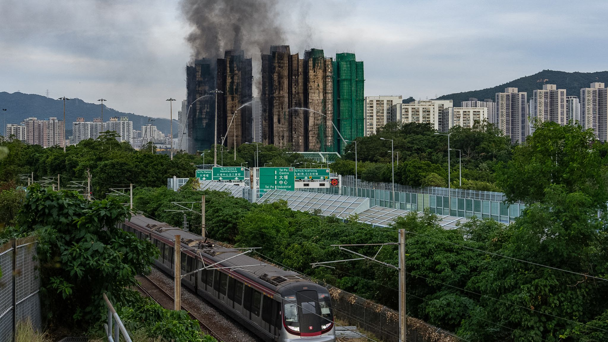 Smoke rises from the complex Hong Kong