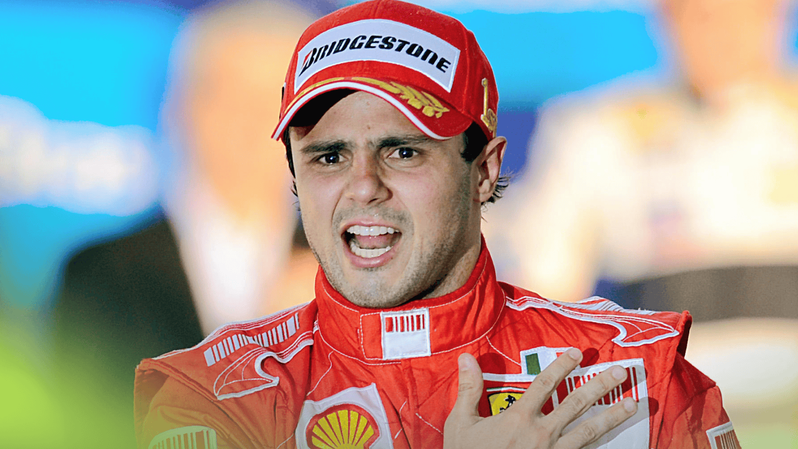 Felipe Massa in his Ferrari race suit and cap, speaking emotionally after a Formula One race.