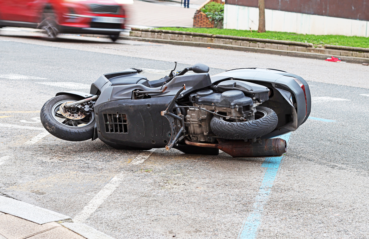 a motorbike lying on a street.