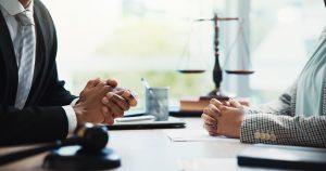 gavel, lawyers and hands of business people in meeting for legal consultation, contract and discussion. corporate, professional and workers in office for legislation, agreement and deal at law firm