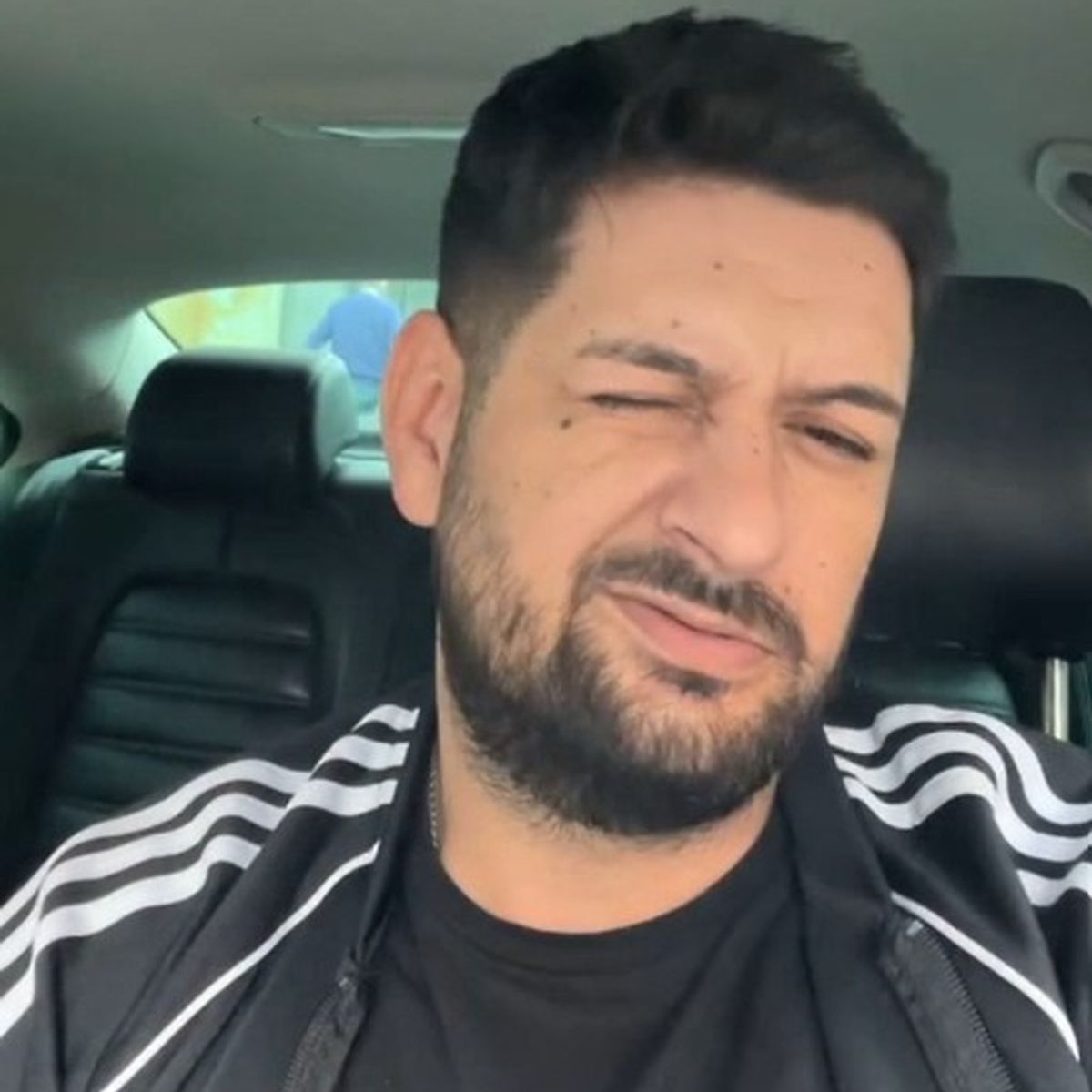 Cumpanasoiu winking to the camera during a video filmed near a brothel in Dundee. Pic: Crown Office