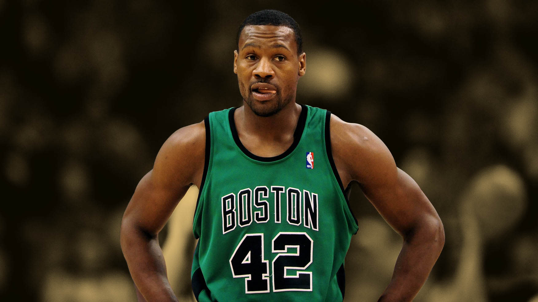 Tony Allen, former Boston Celtics guard, stands on the court wearing his green No. 42 jersey during an NBA game.