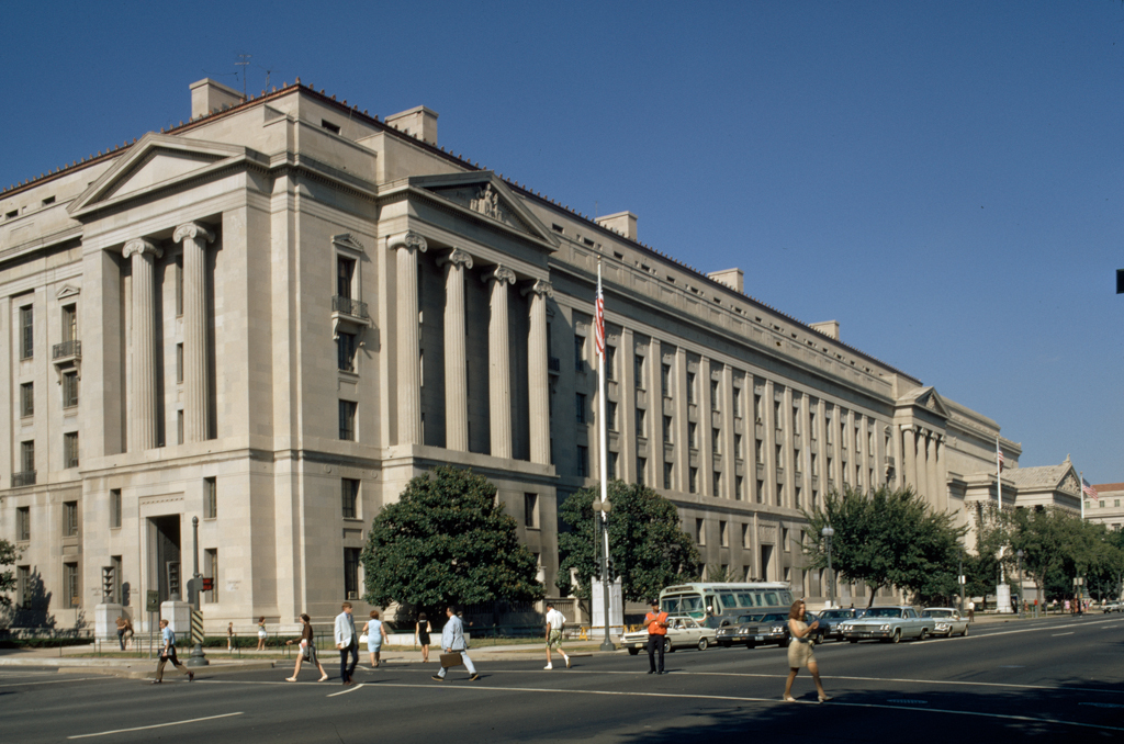 The U.S. Department of Justice headquarters in Washington, D.C., viewed from the street on a clear day.