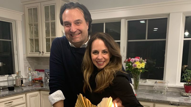 Brian Walshe and Ana Walshe standing together in a kitchen, posing for a photo.
