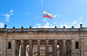 Colombian government building with national flag flying above the fa&ccedil;ade in Bogot&aacute;