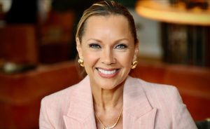 Vanessa Williams smiling during a public appearance in a pink blazer