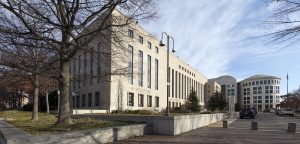 Exterior of a United States federal courthouse representing judicial authority over criminal prosecutions