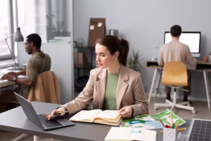 Employee sitting alone at a desk in a modern office